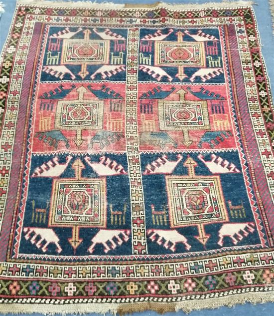 A Turkish red and blue rug 130 x 136cm